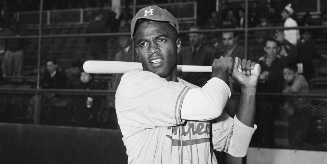 jackie robinson swinging a bat during practice