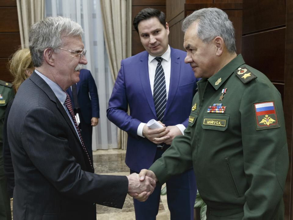 U.S. National Security Adviser John Bolton, left, and Russian Defense Minister Sergei Shoigu shake hands during their meeting in Moscow, Russia, Tuesday, Oct. 23, 2018. U.S. President Donald Trump's national security adviser Bolton struck a conciliatory note Tuesday in talks in Moscow, just days after Trump vowed to pull out of a key arms control treaty with Russia. (Vadim Savitsky, Russian Defense Ministry Press Service via AP)