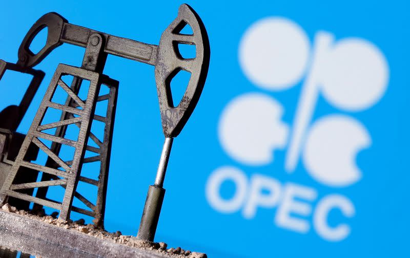 FILE PHOTO: A 3D printed oil pump jack is seen in front of displayed Opec logo in this illustration picture