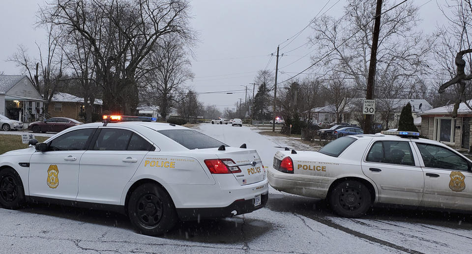 Indianapolis Metropolitan Police Department work the scene Sunday, Jan. 24, 2021 in Indianapolis where five people, including a pregnant woman, were shot to death early Sunday inside an Indianapolis home. The pregnant woman who was taken to an area hospital, both she and the unborn child died despite life-saving efforts. (Justin L. Mack/The Indianapolis Star via AP)