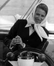 <p>Princess Anne used to take sailing trips with her father, Prince Philip, as a child. Here, at 24 years old, she sails at the helm of a yacht by herself. </p>