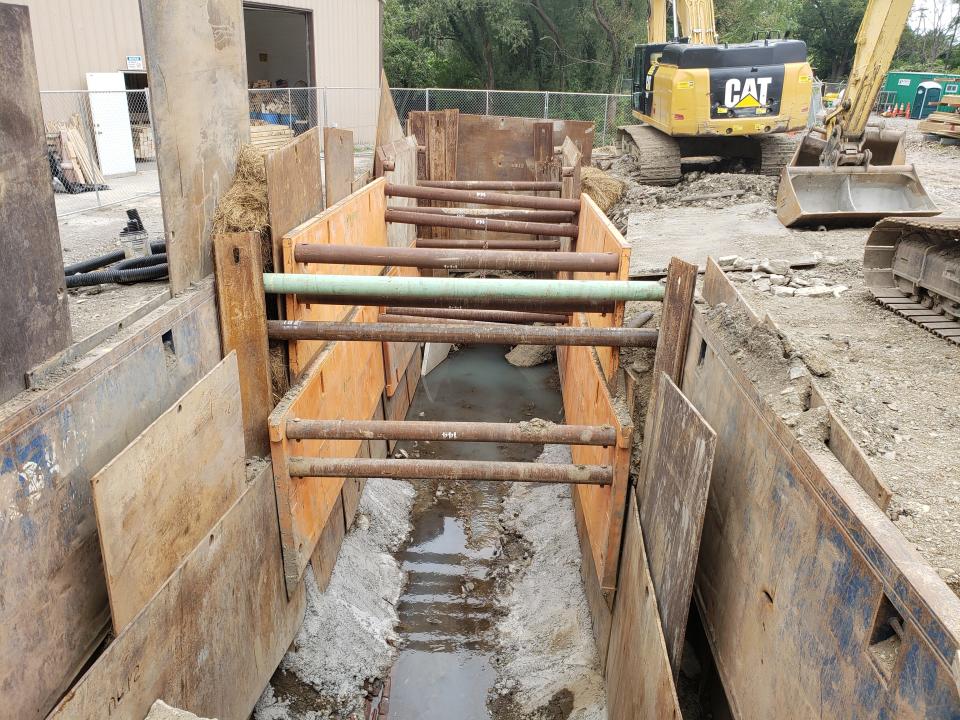 A July 1 storm sewer failure underneath Frontier Lumber, 762 E. Fifth St., created this 30-foot-long sinkhole at the property, photographed on Sept. 1, 2021. Contractors hired by the city of Erie are repairing the storm sewer line and related damage.