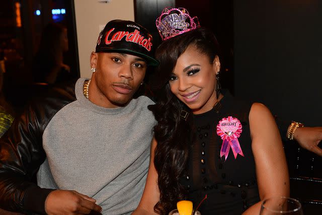 <p>Rick Diamond/Getty</p> Nelly and Ashanti celebrate her birthday in Atlanta in October 2012