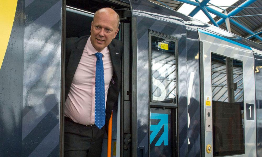 Chris Grayling, the secretary of state for transport, on board a train at Waterloo station in London.