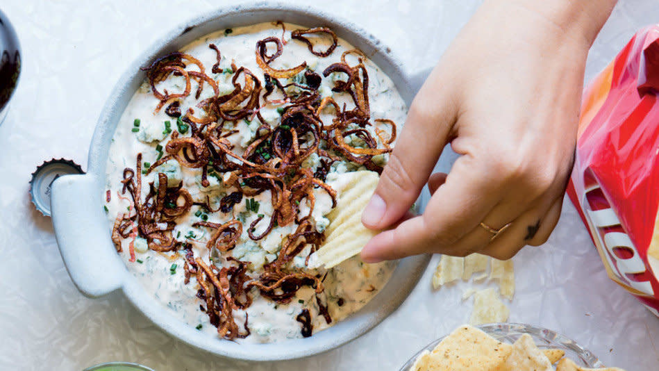 This over-the-top accompaniment for ridged potato chips proves that sometimes, more is more. The dip starts with the basics -- sour cream, mayonnaise, garlic powder -- yet goes way beyond the predictable workhorses, incorporating buttermilk, fresh dill and chives, sweet Spanish paprika and crumbled blue cheese, so it delivers a perfect mash-up of sweet and salty tastes. The icing on the cake is a garnish of fried shallots. <br /><br /> <strong>Get the recipe: <a href="http://www.oprah.com/food/Ultra-Mega-Dip-Recipe" target="_blank">Ultra Mega Dip</a></strong>