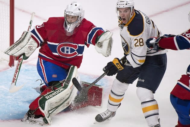 Buffalo Sabres forward Zemgus Girgensons (28) moves in close to Canadiens netminder Zachary Fucale (70) in second period NHL pre-season action at the Bell Centre on Saturday, September 15, 2013. [CP - Graham Hughes]