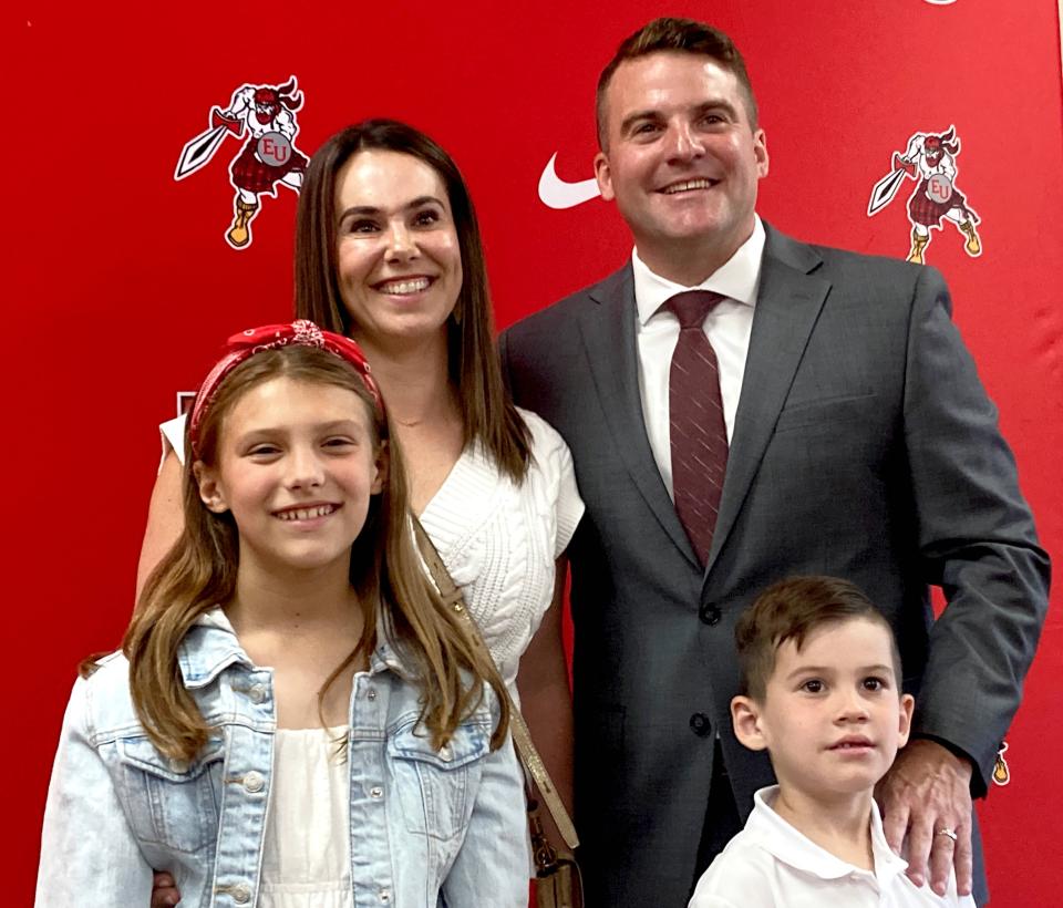 Justin Jennings poses with his wife, Holly, and their two children (left to right) Avery and Easton, during Wednesday's Edinboro University news conference to formally announce him as the Fighting Scots' new men's basketball coach. Jennings, who played for and graduated from Penn State Behrend, was an assistant at Philadelphia's Drexel University for seven seasons.