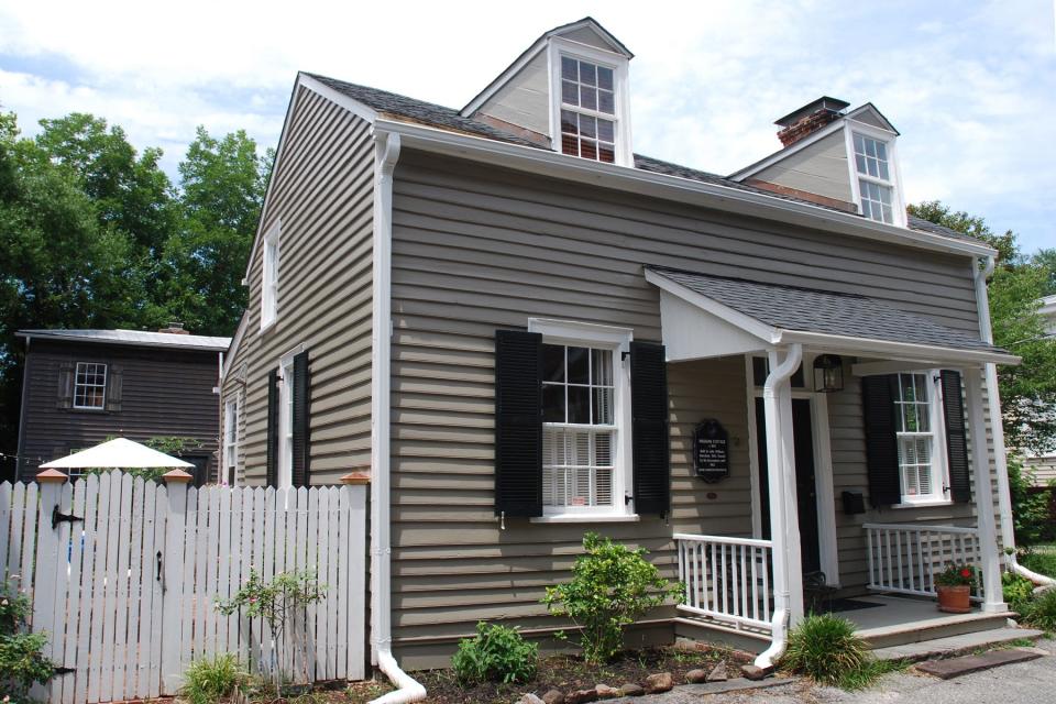 The Williams Cottage at 311 Cottage Lane was built in 1845 and once served as the residence for Wilmington artist Elisabeth Chant. In the background is the Hart Wine house, where Chant had her studio and taught students.