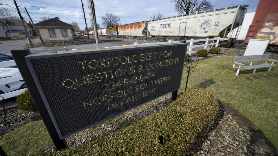 FILE - A sign for toxicologists questions is displayed after a Norfolk Southern derailment in East Palestine, Ohio, Feb. 9, 2023. After the catastrophic train car derailment in East Palestine, Ohio, some officials are raising concerns about a type of toxic substance that tends to stay in the environment. (AP Photo/Gene J. Puskar, File)