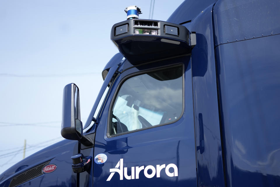 A self-driving tractor trailer is displayed at a test track in Pittsburgh, Thursday, March 14, 2024. The truck, outfitted with 25 laser, radar and camera sensors, is owned by Pittsburgh-based Aurora Innovation Inc. Late this year, Aurora plans to start hauling freight on Interstate 45 between the Dallas and Houston areas with 20 driverless trucks. (AP Photo/Gene J. Puskar)