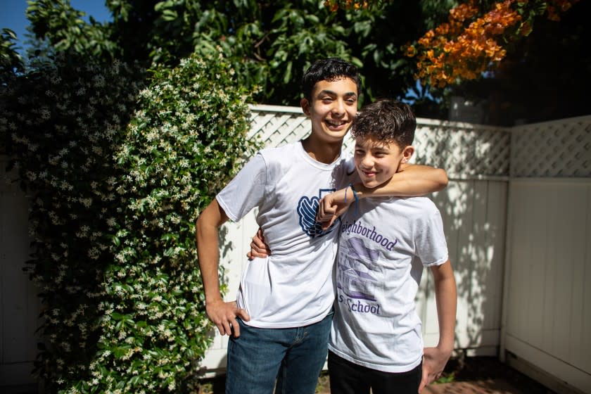 LOS ANGELES, CA - MAY 24: From Left - Sebastian Hernandez, 15 and his brother, Benjamin Hernandez, 12, pose for a portrait during the coronavirus pandemic on Sunday, May 24, 2020 in Los Angeles, CA. While some kids are stressed, confused, bored and isolated during quarantine, the Hernandez brothers have relished the opportunity to slow down. (Jason Armond / Los Angeles Times)