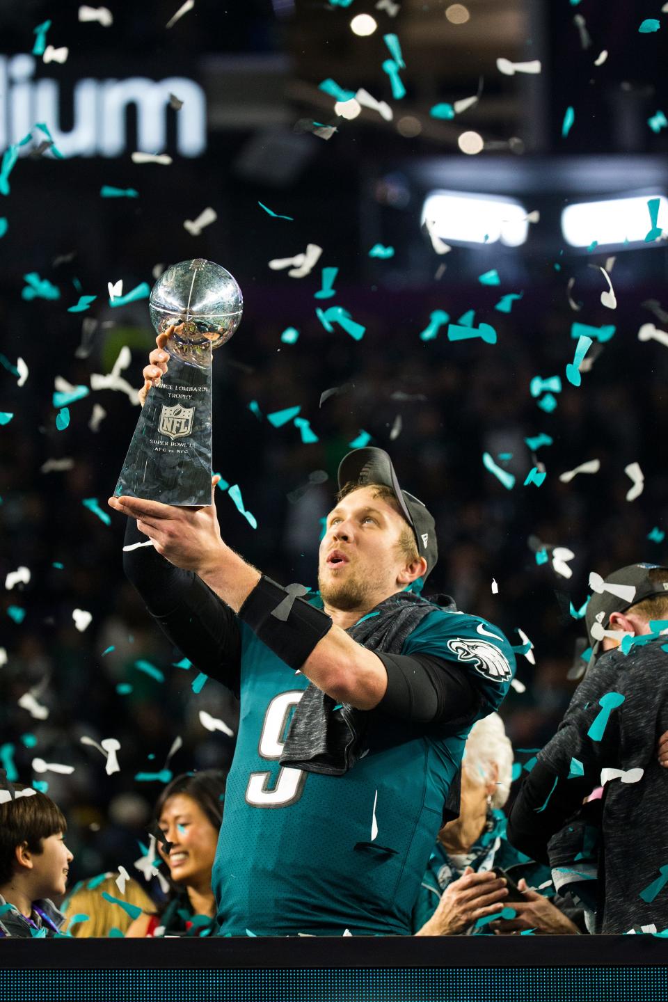 Eagles quarterback Nick Foles holds up the Vince Lombardi Trophy after defeating the New England Patriots 41-33 to win Super Bowl LII in Feb. 2018.