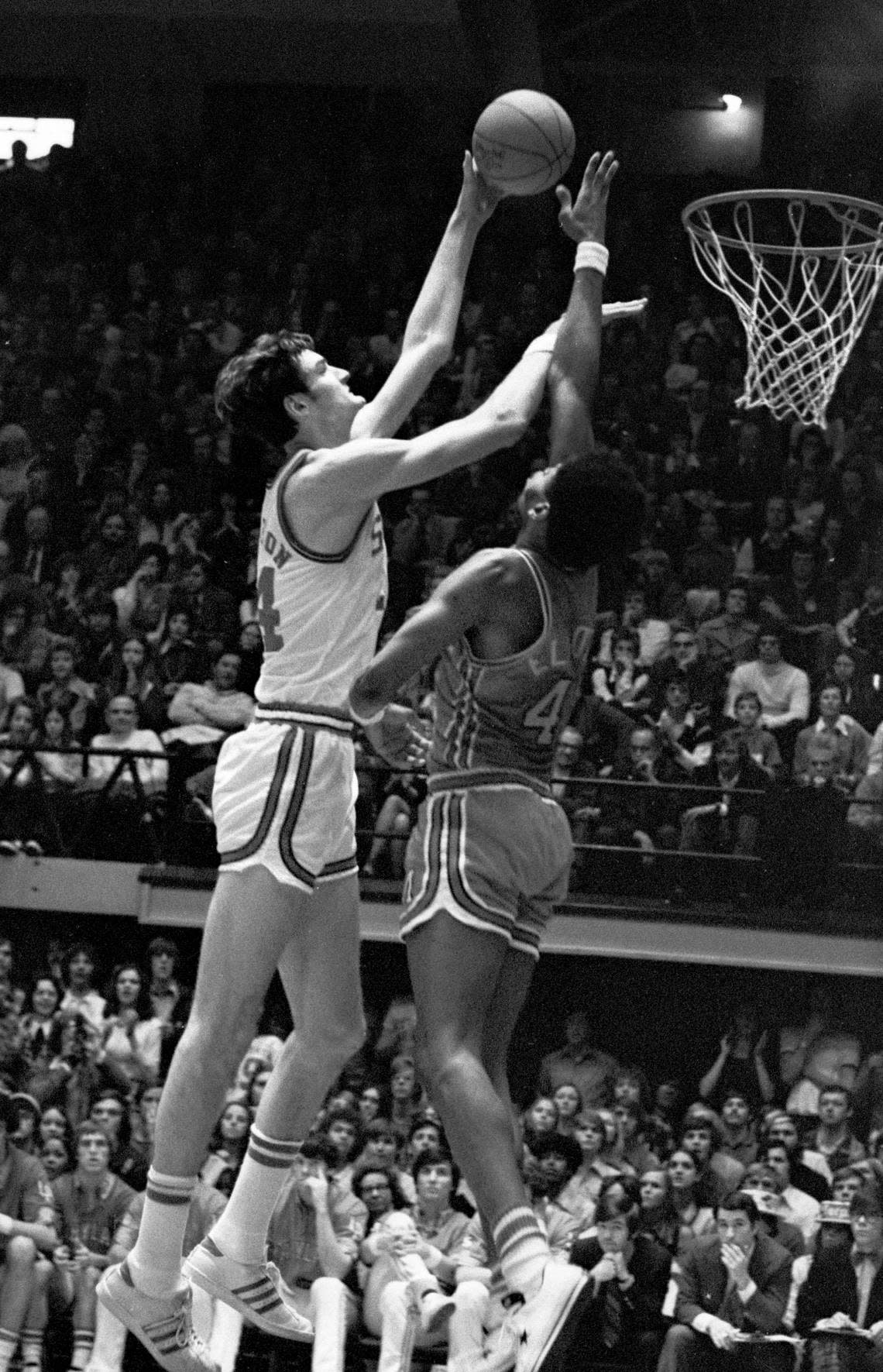 NC State center Tommy Burleson shoots over Maryland’s Len Elmore during the 1974 game between the Wolfpack and the Terps in Reynolds Coliseum.