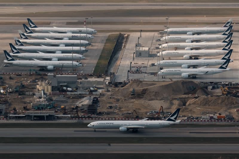 FILE PHOTO: Cathay Pacific aircraft are seen parked on the tarmac at the airport, following the outbreak of the new coronavirus, in Hong Kong