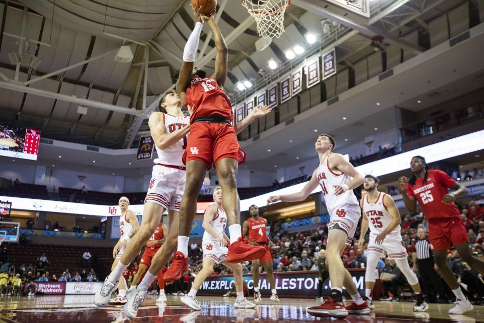 Houston’s J’Wan Roberts (13) goes up to shoot against Utah’s defense in the first half of an NCAA college basketball game during the Charleston Classic in Charleston, S.C., Friday, Nov. 17, 2023. | Mic Smith, Associated Press