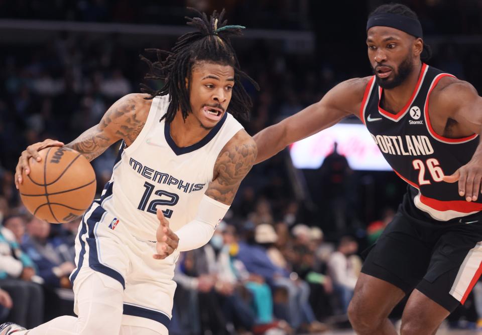 Memphis Grizzlies guard Ja Morant drives past Portland Trail Blazers forward Justise Winslow at FedExForum on Wednesday, Feb. 16, 2022. 