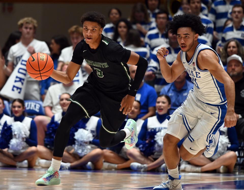 Dartmouth guard Jaren Johnson (5) dribbles up courts as Duke guard Jared McCain defends during the first half at Cameron Indoor Stadium.