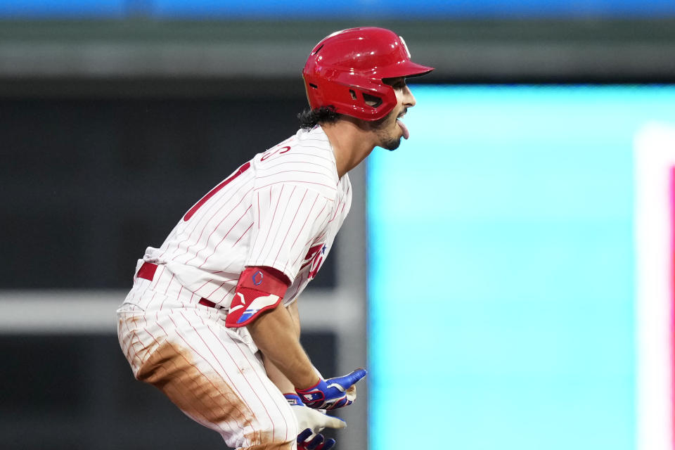 Philadelphia Phillies' Garrett Stubbs reacts after hitting a two-run double against St. Louis Cardinals pitcher Miles Mikolas during the second inning of a baseball game, Friday, Aug. 25, 2023, in Philadelphia. (AP Photo/Matt Slocum)