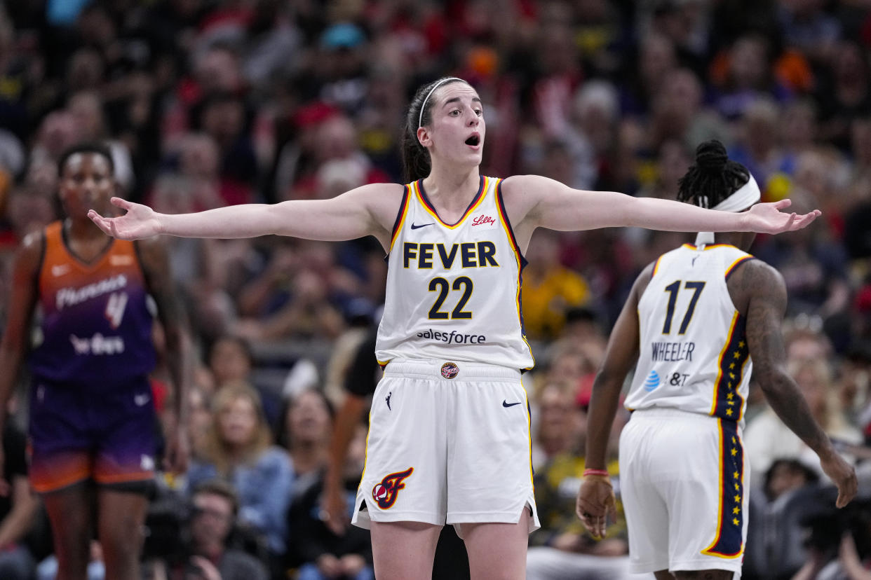 Indiana Fever guard Caitlin Clark (22) reacts to a non-call in the first half of a WNBA basketball game against the Phoenix Mercury in Indianapolis, Friday, July 12, 2024. (AP Photo/Michael Conroy)