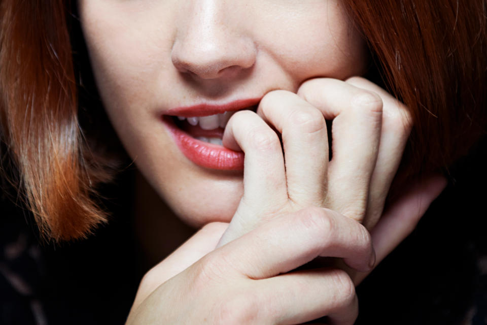 woman biting nails (Tara Moore / Getty Images)