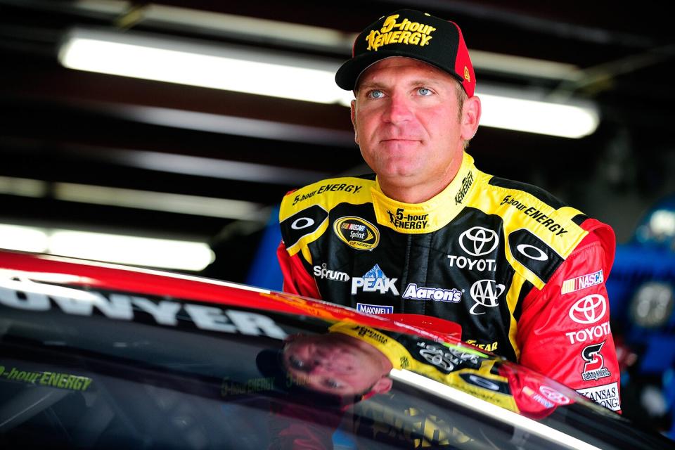Clint Bowyer, driver of the #15 5-Hour Energy Toyota, stands in the garage area during practice for the NASCAR Sprint Cup Series 5-Hour Energy 301 at New Hampshire Motor Speedway on July 17, 2015 in Loudon, New Hampshire.