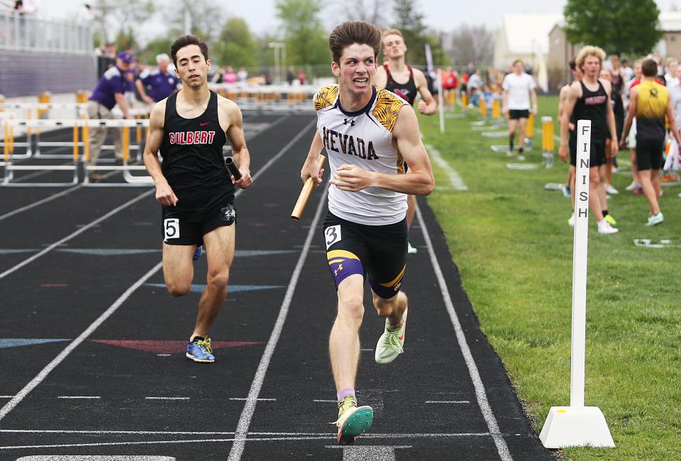 Carter Holland edged past Gilbert's Jonathan Stoker at the finish of the boys 4x800-meter relay to earn first place for Nevada at the Class 3A state qualifying track and field meet at Cub Stadium on Thursday, May 11, 2023, in Nevada, Iowa.