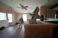 A taxidermy duck is seen as Ted Falgout tours his home which is under extensive repair before he can move back in, in Larose, La., Thursday, April 14, 2022. When Hurricane Ida hit last summer, a storm surge overwhelmed a levee and gushed into Falgout’s coastal Louisiana home. “That water was probably 60% mud,” said Falgout, who’s hoping relief is on the way for his community, about 30 miles southwest of New Orleans. (AP Photo/Gerald Herbert)