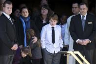 Mimi O'Donnell (2nd L) stands with her children Willa, Tallulah and Cooper as they watch the casket following the funeral for their father, actor Phillip Seymour Hoffman in the Manhattan borough of New York, February 7, 2014. REUTERS/Brendan McDermid