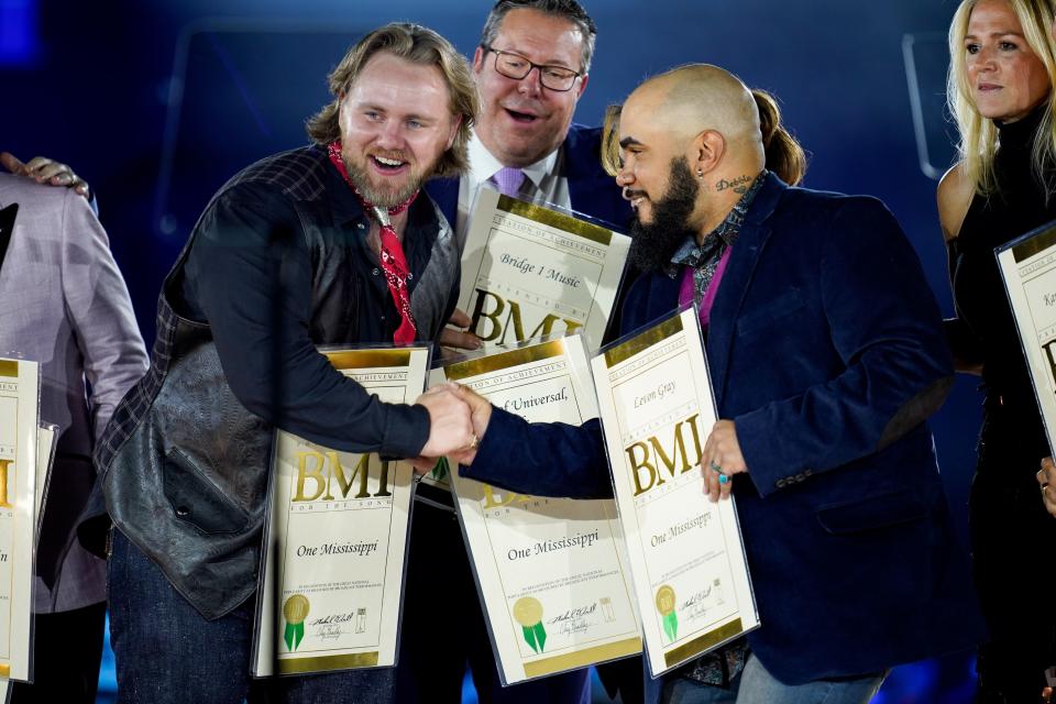 Ernest and Levon Gray shake hands as they are honored for the song One Mississippi during the BMI’s 70th Annual Country Awards at the BMI Music Row Headquarters in Nashville, Tenn., Tuesday, Nov. 8, 2022.