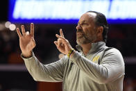 Notre Dame's coach Mike Brey signals during the first half of an NCAA college basketball game against Illinois Monday, Nov. 29, 2021, in Champaign, Ill. (AP Photo/Michael Allio)