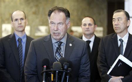 Orange County District Attorney Tony Rackauckas (C) speaks at a courthouse news conference after two former policemen were acquitted in the 2011 beating and stun-gun death of Kelly Thomas in Santa Ana, California January 13, 2014. REUTERS/Alex Gallardo