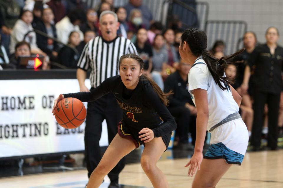 Tohatchi's Brooke Badonie looks to the basket while being guarded by Navajo Prep's Lailah McGary during the first quarter of a district basketball game, Saturday, Jan. 21, 2023 at the Eagles Nest.