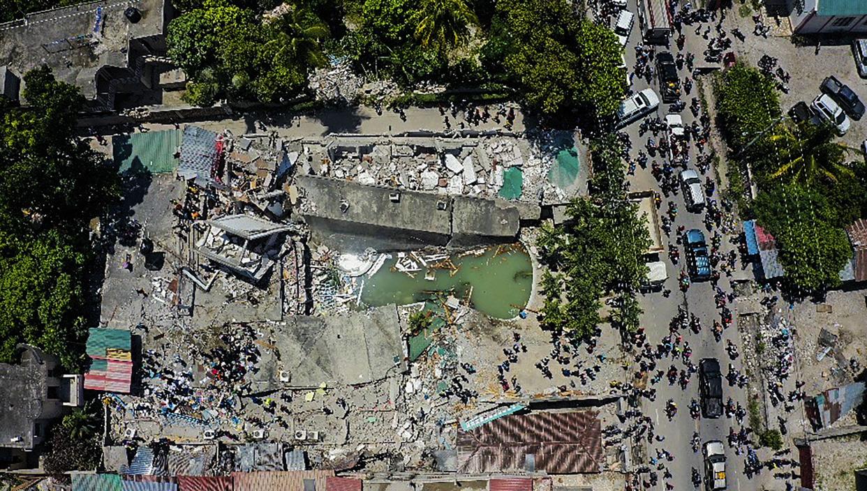 An aerial view shows the Hotel Le Manguier destroyed by an earthquake in Les Cayes, Haiti, Saturday, Aug. 14, 2021.