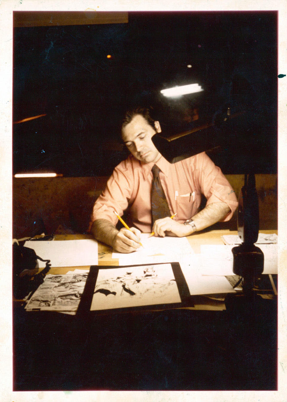 Neal Adams at work in the early 1970s - Credit: Courtesy of the Adams Family