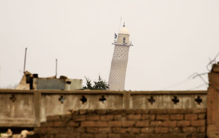 FILE PHOTO: Mosul's Al-Hadba minaret at the Grand Mosque, where Islamic State leader Abu Bakr al-Baghdadi declared his caliphate back in 2014, is seen during clashes between Iraqi forces and Islamic State militants, in Mosul, Iraq March 19, 2017. REUTERS/Thaier Al-Sudani/File Photo