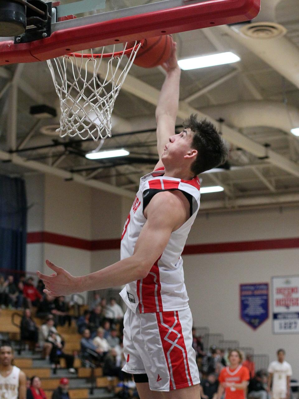 Utica senior Trenton Collins dunks during the Licking-Muskingum All-Star Game Sunday at Licking Valley High School.