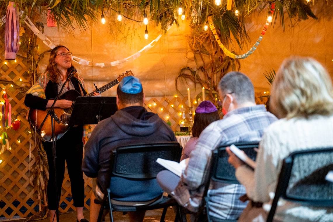 Rabbi Keren Gorban, 37, sings and plays the guitar during a service for the Sukkot holiday on Friday, Oct. 14, 2022, at Temple Beth El in Tacoma. Gorban, who started the position on July 1, was previously the associate rabbi at Temple Sinai in Pittsburgh for seven years.