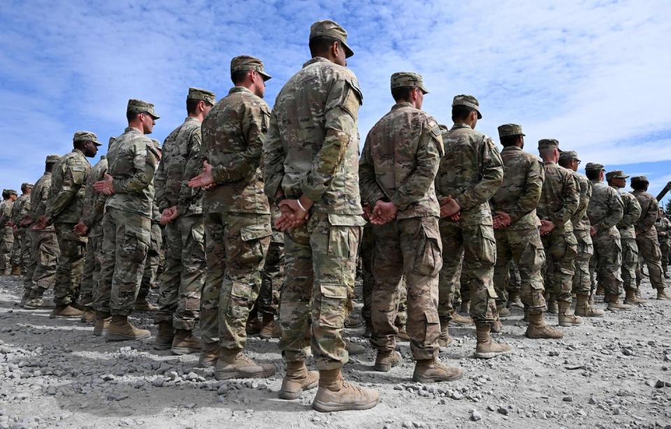 U.S. soldiers stand to attention at the United States Army military training base in Germany on July 13, 2022. <a href="https://www.gettyimages.com/detail/news-photo/soldiers-stand-to-attention-at-the-united-states-army-news-photo/1241877321?adppopup=true" rel="nofollow noopener" target="_blank" data-ylk="slk:Christof Stache/AFP via Getty Images;elm:context_link;itc:0;sec:content-canvas" class="link ">Christof Stache/AFP via Getty Images</a>