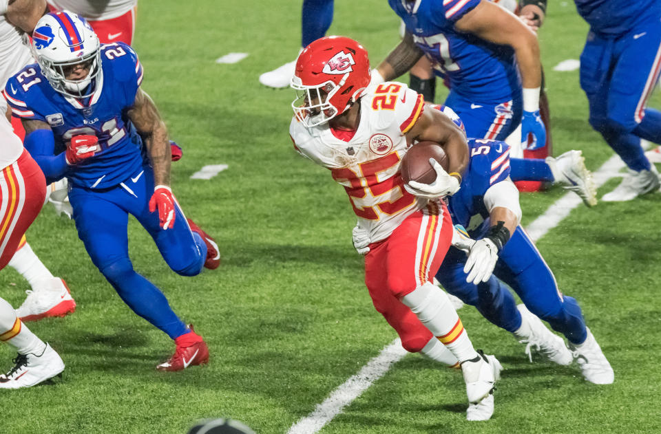 Oct 19, 2020; Orchard Park, New York, USA; Kansas City Chiefs running back Clyde Edwards-Helaire (25) runs against Buffalo Bills free safety Jordan Poyer (21) and outside linebacker A.J. Klein (54)  in the third quarter at Bills Stadium. Mandatory Credit: Mark Konezny-USA TODAY Sports