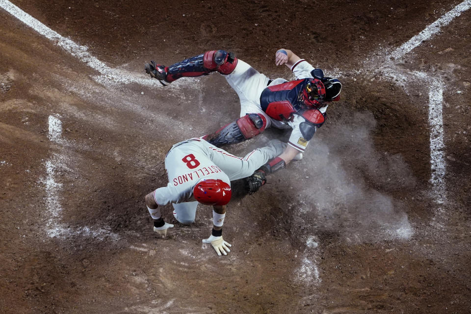 Philadelphia Phillies' Nick Castellanos (8) is tagged out by Atlanta Braves catcher Sean Murphy during the seventh inning of a baseball game Thursday, May 25, 2023, in Atlanta. (AP Photo/John Bazemore)