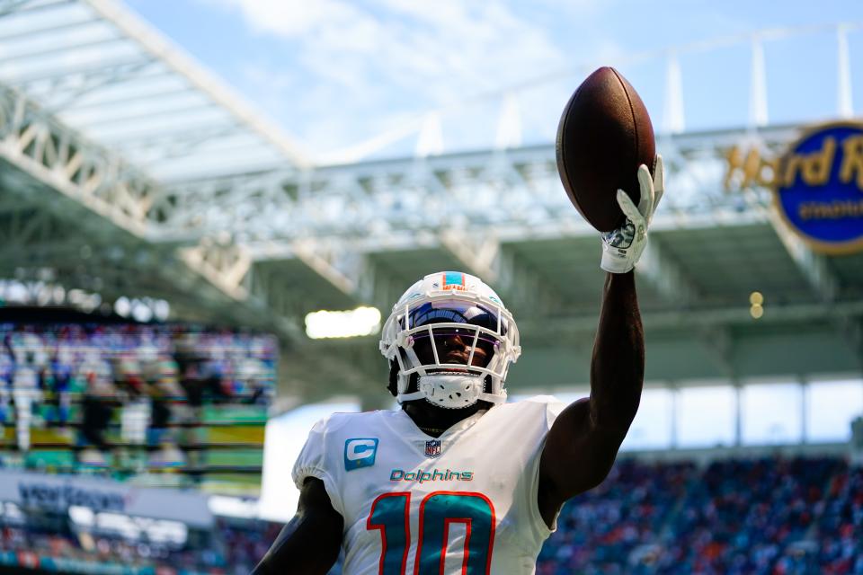 Dolphins wide receiver Tyreek Hill celebrates after teammate Chase Edmonds' touchdown.