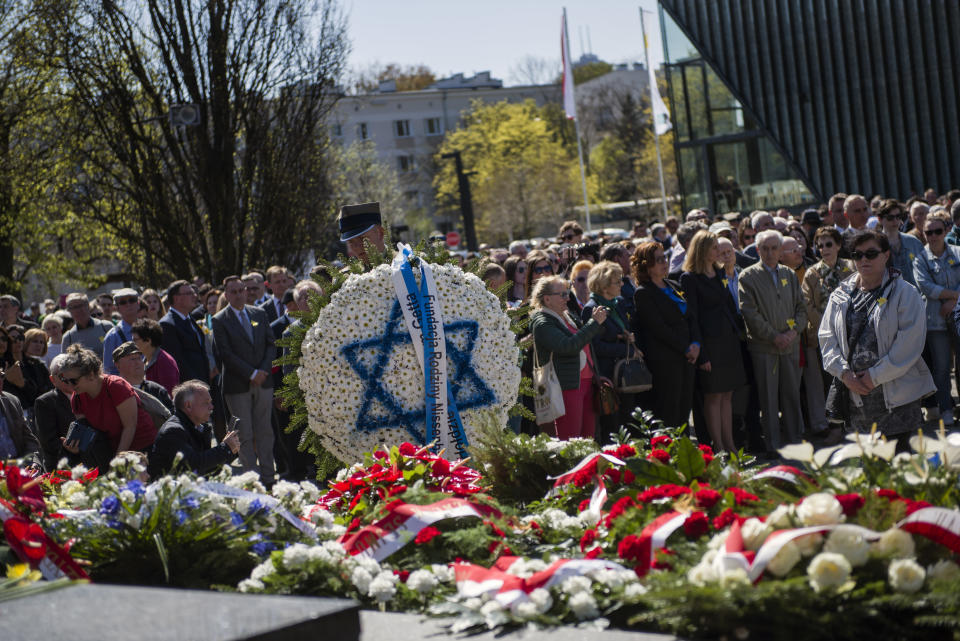 WARSAW, MAZOWIECKIE, POLAND - 2019/04/19: A soldier seen carrying a wreath during a ceremony to mark the 76th anniversary of the outbreak of the Warsaw Ghetto Uprising. As part of the ceremony alarm sirens were heard throughout the city to remember those who were murdered in the ghetto in 1943. The Warsaw ghetto uprising was a violent revolt that occurred from April 19 to May 16, 1943, during World War II. Residents of the Jewish ghetto in Nazi-occupied Warsaw, Poland, staged the armed revolt to prevent deportations to Nazi-run extermination camps. (Photo by Attila Husejnow/SOPA Images/LightRocket via Getty Images)