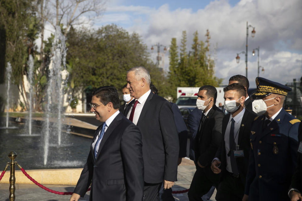 Israeli Defence Minister Benny Gantz is welcomed by Morocco's Foreign Minister Nasser Bourita, in Rabat, Morocco, Wednesday, Nov. 24, 2021. Israel and Morocco signed a landmark agreement Wednesday that lays the foundation for security cooperation, intelligence sharing, and future arms sales. (AP Photo/Mosa'ab Elshamy)