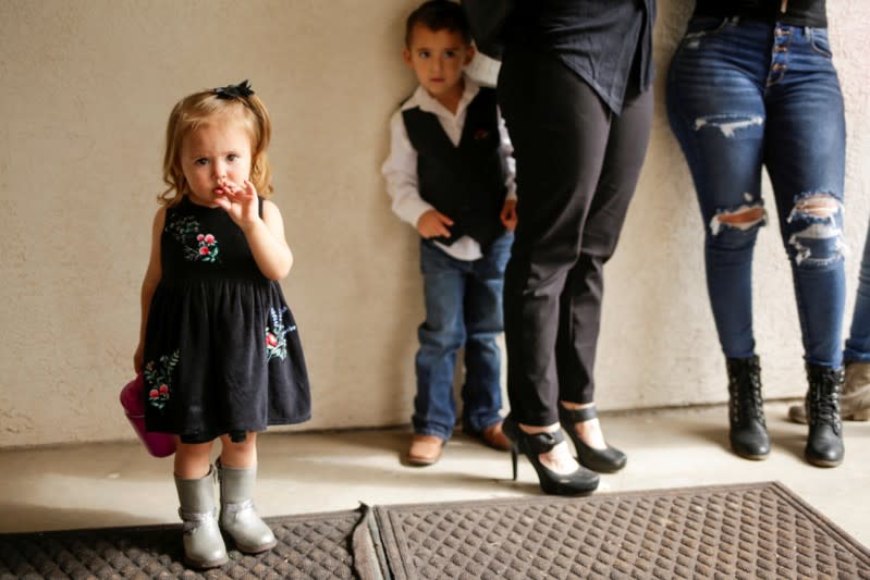 A relative of Christina Marie Langford Johnson, who was killed by unknown assailants, attends her funeral service, before a burial at the cemetery in LeBaron, Chihuahua