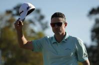 Justin Rose of England waves on the 18th after finishing his third round play during the 2017 Masters golf tournament at Augusta National Golf Club in Augusta, Georgia, U.S., April 8, 2017. REUTERS/Brian Snyder