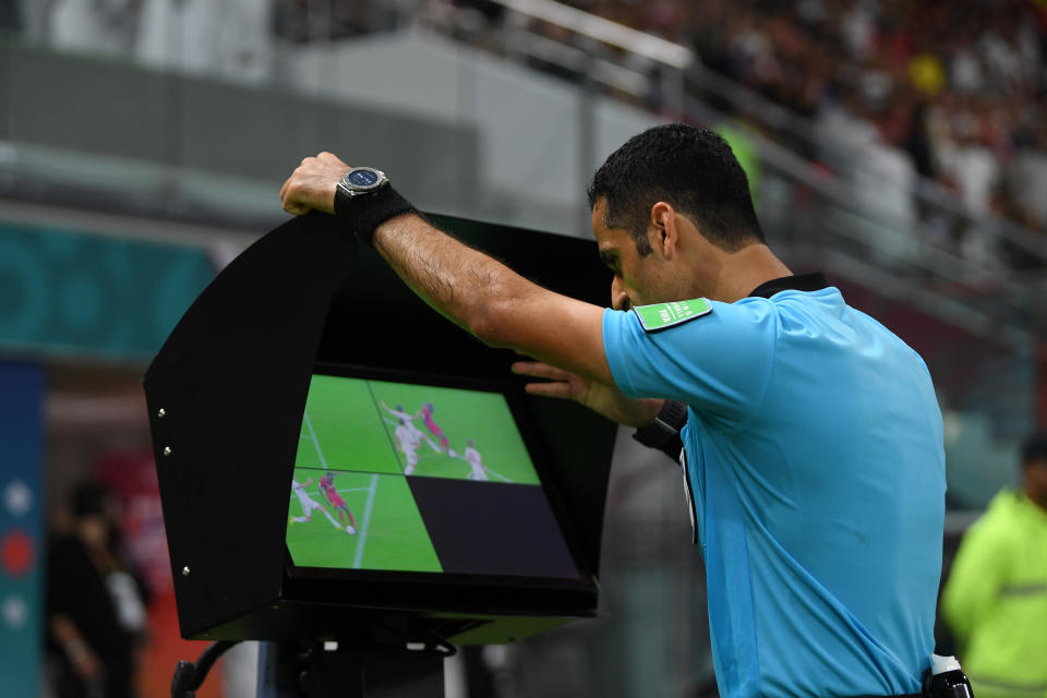 DOHA, QATAR - DECEMBER 21: Match referee Abdulrahman Al-Jassim reviews a foul on the VAR screen during the FIFA Club World Cup Qatar 2019 Final match between Liverpool FC and CR Flamengo at Khalifa International Stadium on December 21, 2019 in Doha, Qatar. (Photo by Mike Hewitt - FIFA/FIFA via Getty Images)