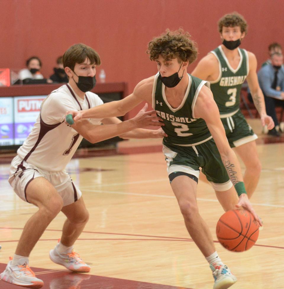 Griswold junior Jacob Strain makes his move against Killingly defender Jason Simoneau in a game earlier this season.