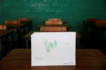 A drawing made during a lesson at a school shows what a student ate during the course of a day in Caracas, Venezuela July 14, 2016. The child drew corn cake with egg, and the teacher wrote that the child didn't have any breakfast. Picture taken July 14, 2016. REUTERS/Carlos Jasso