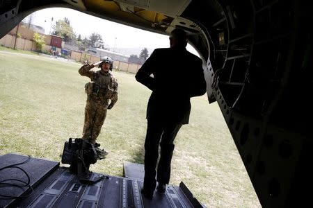 U.S. Defense Secretary James Mattis is saluted by a member of his U.S. Army helicopter crew as he arrives at Resolute Support headquarters in Kabul, Afghanistan April 24, 2017. REUTERS/Jonathan Ernst