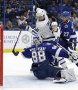 Toronto Maple Leafs center John Tavares (91) tries to bat the puck past Tampa Bay Lightning goaltender Andrei Vasilevskiy (88) during the first period of an NHL hockey game Thursday, Dec. 13, 2018, in Tampa, Fla. (AP Photo/Chris O'Meara)